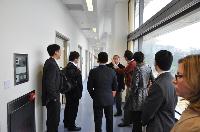 The delegates visit the animal holding facilities at the School